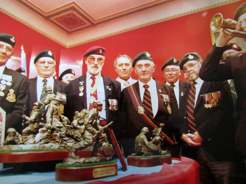 George Plim, a member of the Korean War Veterans Association plays the bugle at the presentation of the statue to the Royal Marines Museum at Eastney. 6th August 1992