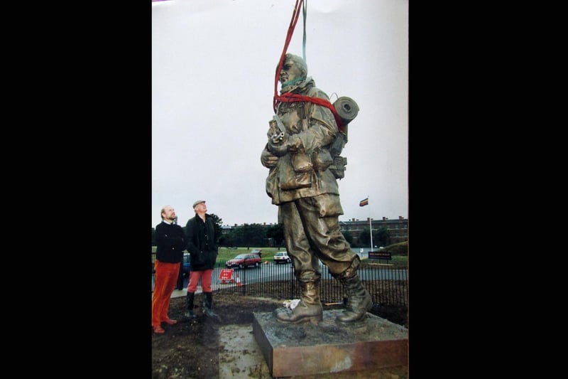 The Yomper staue being erected at the entrance to the Royal Marines Museum at Eastney, being inspected by sculptor Philip Jackson (left) and Colonel Keith Wilkins director of the museum 5th July 1992