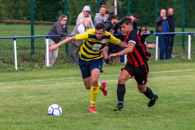 Paulsgrove striker Michael Baker runs at the Fleetlands defence. Picture: Mike Cooter