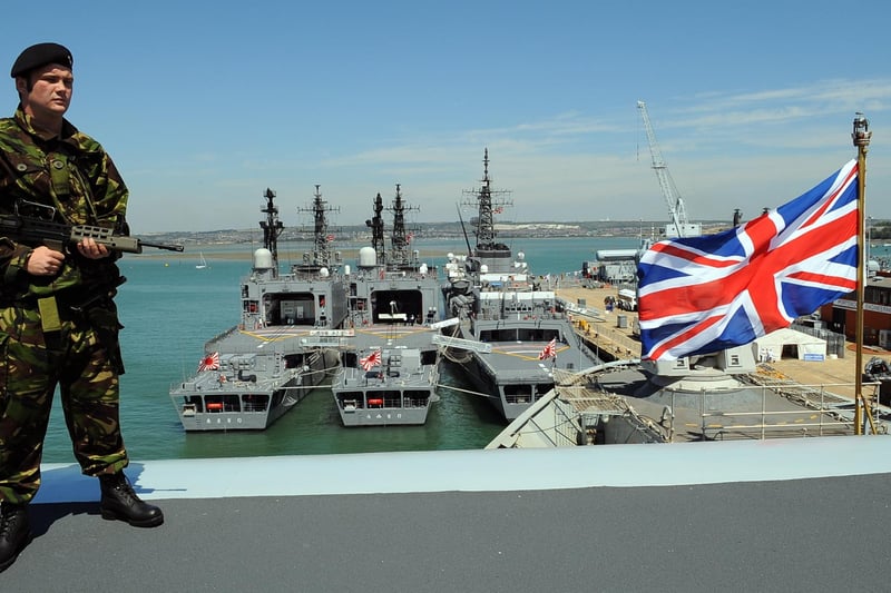 Able seaman Danny Jones (20) on the top of the flight deck ramp on board HMS Illustrious, overlooking the three Japanese ships from the Japan Maritime Self Defence Force (JMSDF) alongside for The Meet Your Navy - Navy Days 24th August 2008.Picture: Malcolm Wells 083132-6895