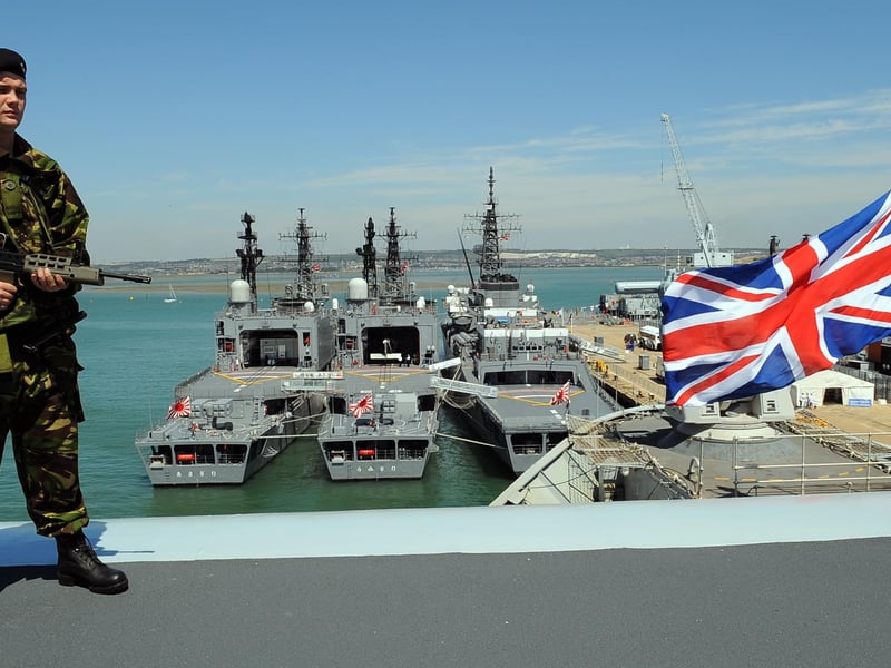 Able seaman Danny Jones (20) on the top of the flight deck ramp on board HMS Illustrious, overlooking the three Japanese ships from the Japan Maritime Self Defence Force (JMSDF) alongside for The Meet Your Navy - Navy Days 24th August 2008.Picture: Malcolm Wells 083132-6895