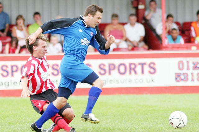 Chris Adam on the charge for Ilkeston.