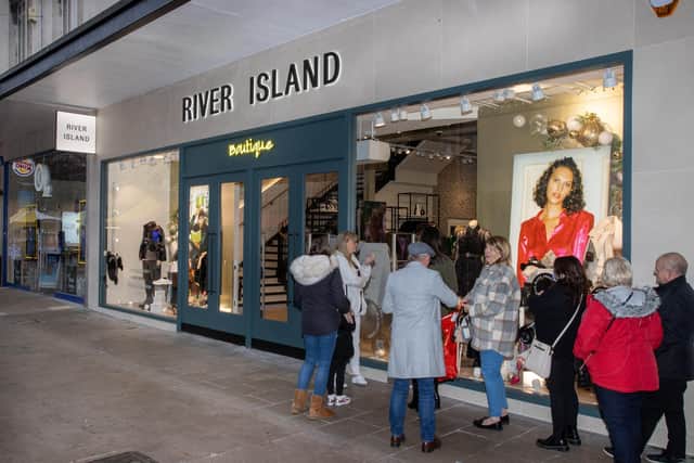 A long queue formed as River Island opened its Boutique Concept Store on Portsmouth's Commerical Road on Saturday morning. Photos by Alex Shute