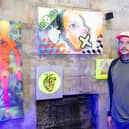 Mark Kellett with some of his work at the Out of My Mind exhibition at the Round Tower, Old Portsmouth. Picture by Matthew Clark