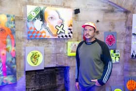 Mark Kellett with some of his work at the Out of My Mind exhibition at the Round Tower, Old Portsmouth. Picture by Matthew Clark