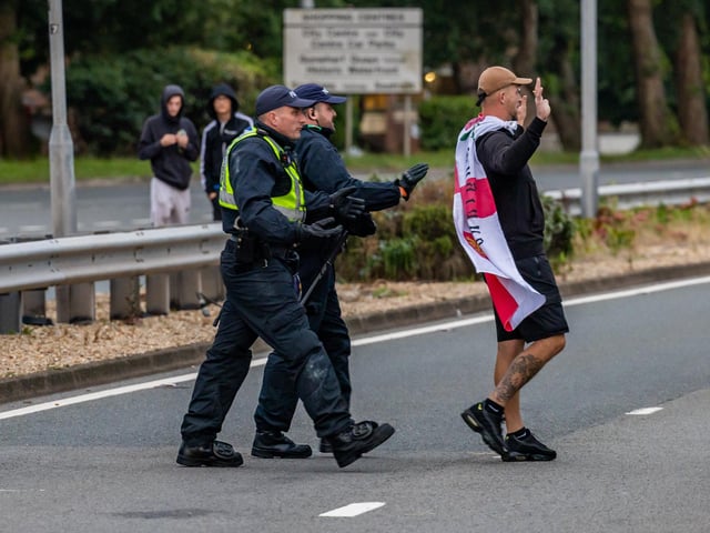 The M275 is brought to a standstill by Anti-immigration protesters. Picture: Mike Cooter (070824)