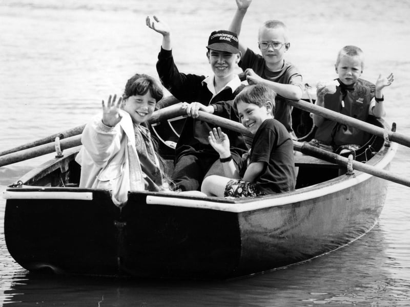 Sea scout Jonathan Coupe takes the strain on the oars as he gives a guided trip around Fareham Creek in July 1993. The News PP4065