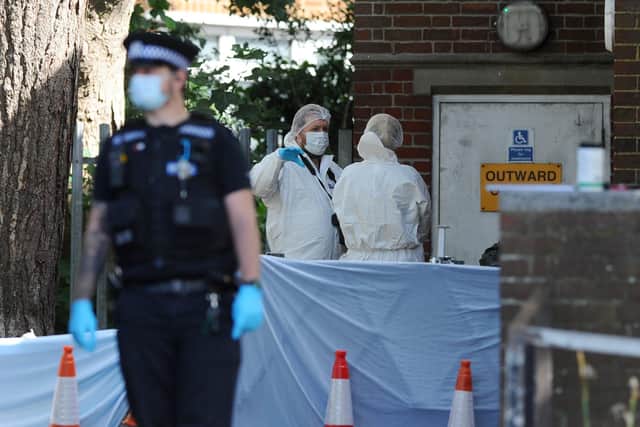 Detectives have launched an investigation after a man's body was found outside Cosham Library on Friday morning, July, 3.
Pictured is: Forensic officers investigating the scene.
Picture: Sarah Standing (030720-5310)