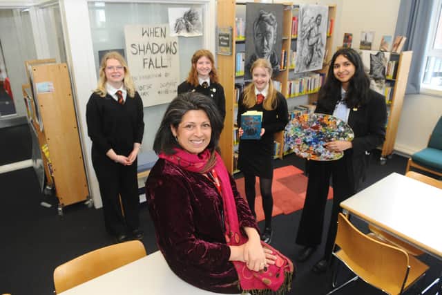 On International Women’s Day, Portsmouth Grammar School welcomed author Sita Brahmachari who took part in a variety of projects with pupils from across the school. Pictured is: (front ) Author Sita Brahmachari with (l-r) Phoebe Clark (17), Sophie Matheson (17), Saffron Irons (17) and Anjali Arackal (16).Picture: Sarah Standing (080322-550)