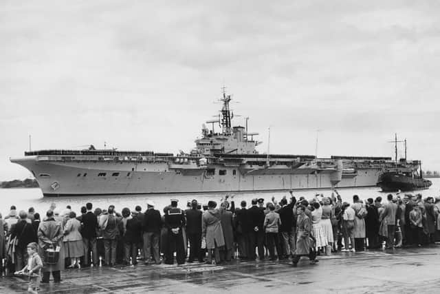 Officers and crew line the flight deck of the Royal Navy Centaur-class light fleet aircraft carrier HMS Bulwark as she is waved off by family and holidaymakers on the quayside for patrol in the Mediterranean on 7 July 1956. Preparations were made for her to join the Falklands effort but eventually it was discovered that she was not in good enough condition  Picture: George W. Hales/Fox Photos/Hulton Archive/Getty Images