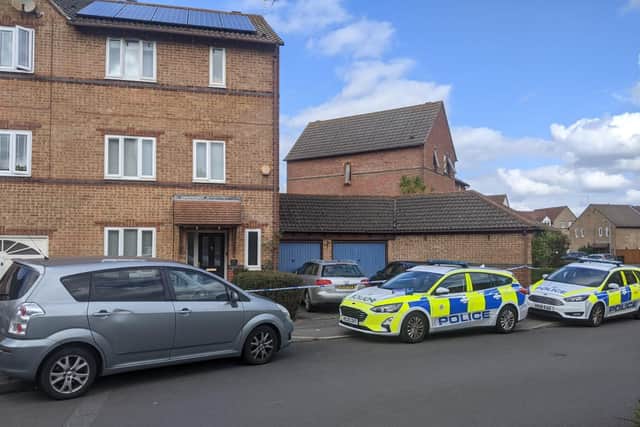 Police outside a house in Holcot Lane, Anchorage Park, Portsmouth after two bodies were discovered 
A murder probe has been launched after the death of a 60-year-old woman, and the body of a 66-year-old man was also found
Picture: Emily Jessica Turner