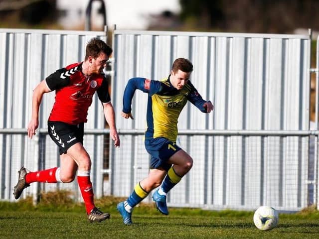 Teenage striker Evan Harris gets away from his man in Moneyfields' defeat to Bournemouth Picture: Dave Bodymore
