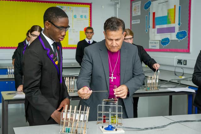 Rt Rev Jonathan Frost doing science experiments with Oren Campbell. Picture: Habibur Rahman