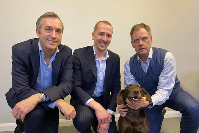 From left to right: David Sherratt, Tyler Daly and Ton Christiaanse, accompanied by Rudi the dog.