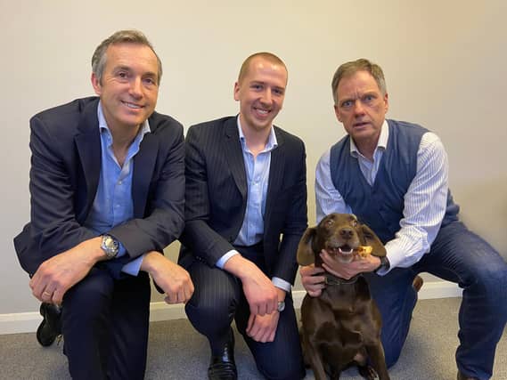 From left to right: David Sherratt, Tyler Daly and Ton Christiaanse, accompanied by Rudi the dog.