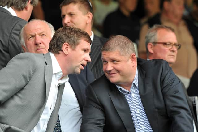 Roman Dubov (right) with Vladimir Antonov (left) at Pompey's Championship clash with Brighton in August 2011. Picture:Steve Reid