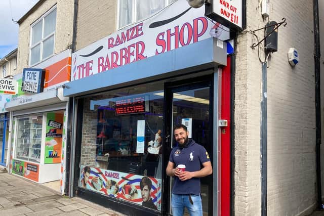 Mo Alzafiri, 27, from Fareham, a barber at Ramze The Barber Shop in West Street. Picture: Kimberley Barber