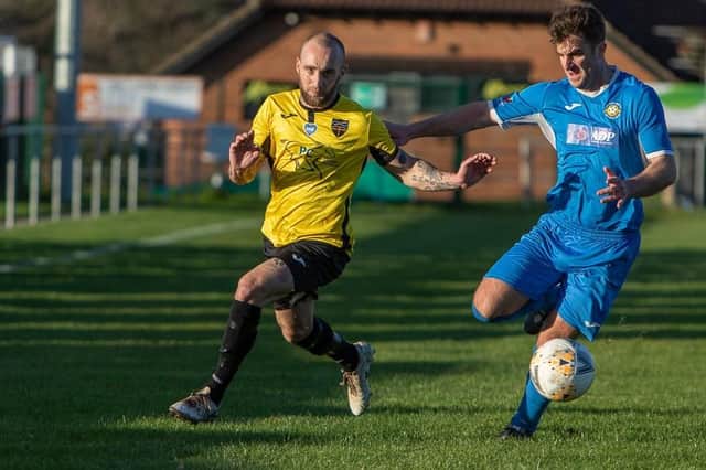 Danny Phillips, left, in action for Infinity against Liphook this season. Picture by Kevin Steele.