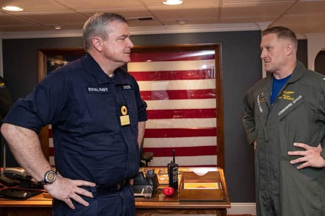 Commodore Paul Strode, L, speaking to Captain Rick Burgess, Commanding Officer of the USS Gerald R Ford. Picture: MC3 Simon Pike/Royal Navy.