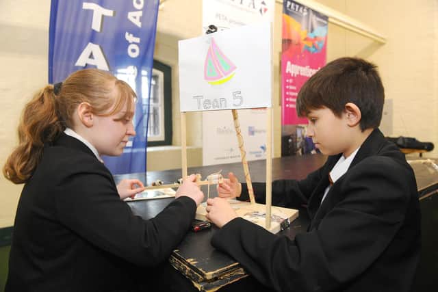 Maisie Heggie, 12, and Declan Wilson, 12, make final adjustments to their billboard beacon.
Picture: Sarah Standing