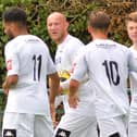 Tommy Scutt, right, is congratulated after one of his two goals at Three Bridges. Picture by Martyn White
