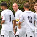 Tommy Scutt, right, is congratulated after one of his two goals at Three Bridges. Picture by Martyn White