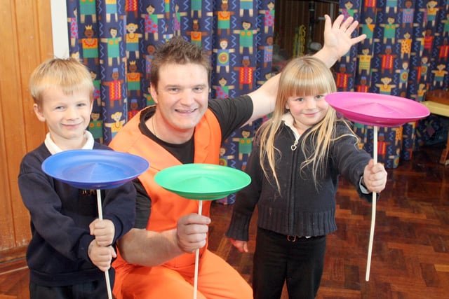 Marcus Woodvine, 6, and Taela Collin, 5, are taught circus skills by Mark Brant at Speedwell School, Staveley in 2006.