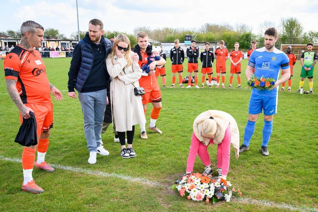 Mason Peddle's mother lays a wreath on the centre spot. Picture: Keith Woodland (150421-16)