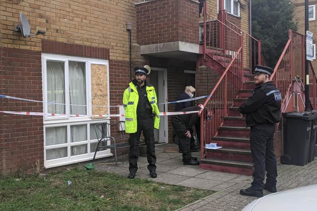 Police and fire investigation staff at the flat in Crabbe Court. Picture: Emily Turner