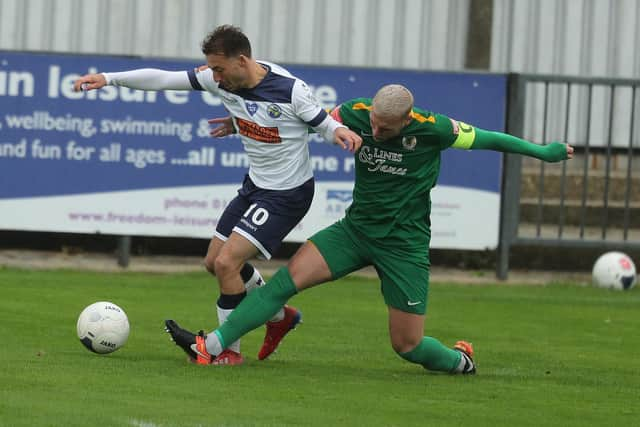 Joe Iaciofano battles with Horsham's Will Miles. Picture: Dave Haines.