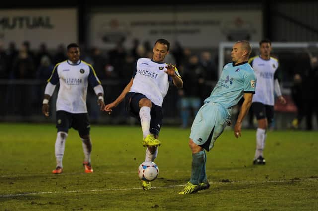 Josh Huggins (middle) in action for Hawks during their 2-0 home loss to Boreham Wood in the play-off semi-final first leg in 2015. Picture: Sarah Standing
