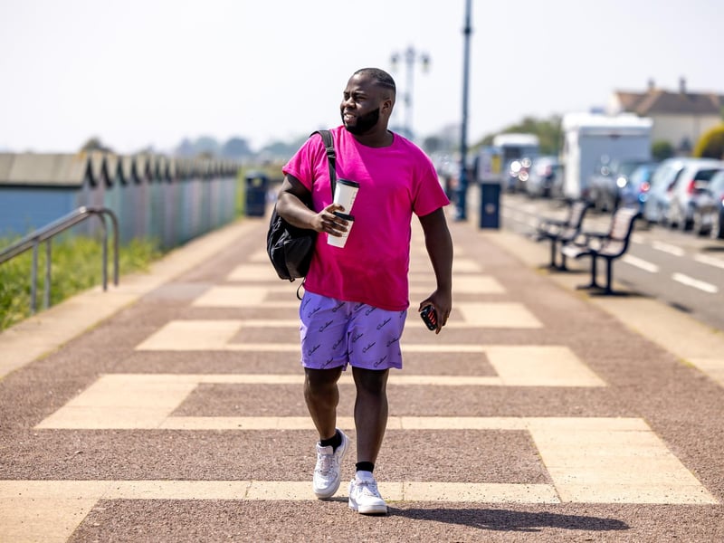 Luis Siobo (31) visiting from London strolling along Eastney promenade. Picture: Mike Cooter (110524)