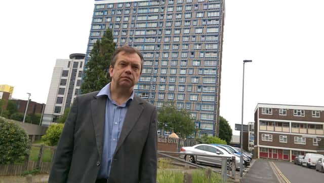 Portsmouth City Council housing cabinet member Councillor Darren Sanders outside Horatia House in Portsmouth, which previously had its cladding removed. Picture: Malcolm Wells