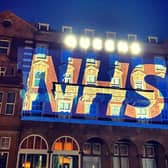 Queens Hotel lit up supporting the NHS