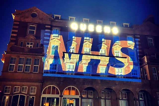 Queens Hotel lit up supporting the NHS