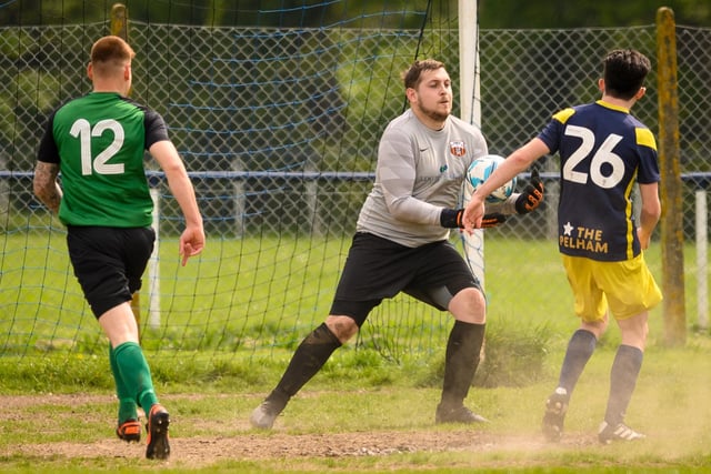 Action from Saturn Royale's 1-0 win over Pelham Arms (blue and yellow kit) in the second Adelaide Cup semi-final. Picture: Keith Woodland (300421-900)