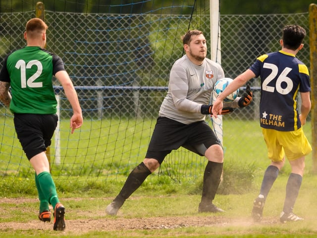 Action from Saturn Royale's 1-0 win over Pelham Arms (blue and yellow kit) in the second Adelaide Cup semi-final. Picture: Keith Woodland (300421-900)