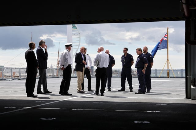 Prince Edward pictured with crew of RFA Tidesurge with Portsmouth's Spinnaker Tower in the background. Photo: LPhot Ben Corbett
