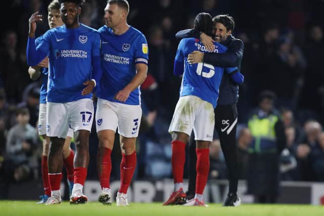 Danny Cowley embraces Mahlon Romeo following Pompey's 2-1 success over AFC Wimbledon on Saturday: Picture: Joe Pepler