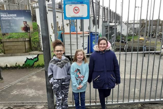 (Left to right) Courtney Willet, 8, Jacee Outon, 7, and Ruby Jacobs, 11, entered a competition to design a no smoking sign for outside their playground.