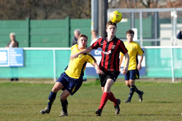 Moneyfields' Jake Raine (left) and Fareham's Mark Wheeler during a Wessex League Premier game at Cams Alders in 2013/14. The two clubs will meet again in the Wessex next season after Moneys took voluntary relegation. Picture: Allan Hutchings