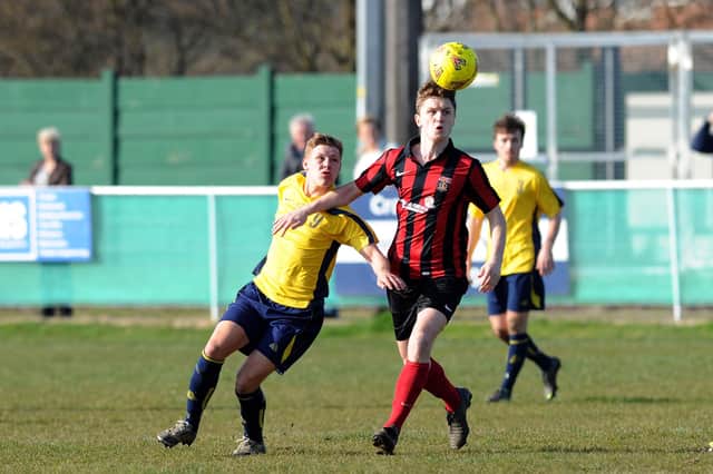 Moneyfields' Jake Raine (left) and Fareham's Mark Wheeler during a Wessex League Premier game at Cams Alders in 2013/14. The two clubs will meet again in the Wessex next season after Moneys took voluntary relegation. Picture: Allan Hutchings
