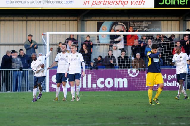 Sahr Kabba, left, celebrates his goal for Hawks against Gosport on Boxing Day, 2013.  Picture: Allan Hutchings