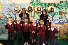 Executive Headteacher Sara Paine (L) and Head of Meon Infant School Ruth Vonk (R) celebrate with children.