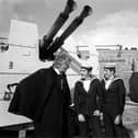 In 1971, Doctor Who came to Portsmouth. Third Doctor serial The Sea Devils starred Jon Pertwee and included several locations in the city.
Jon Pertwee is here pictured at Fraser Gunnery Range at Eastney. Pictured with him L-R: Ordnance electrical mechanic Stephen Scholes from Leeds, control electrical mechanic Gerald Taylor from Wolverhampton (who were acting as extras in the filming), and David King from Chichester House. West Leigh is pictured taking a photo. 

Picture: The News 715097-2