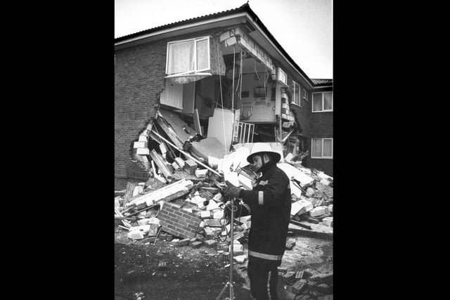 A firefighter stands amidst the debris after there was an explosion at a house in Southwood Road on Hayling Island in February 1991. Picture: The News PP3143