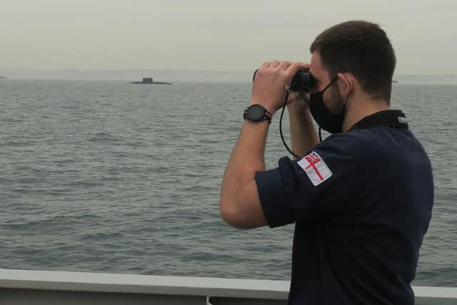 Sailor on Portsmouth-based HMS Mersey monitors Russian submarine RFS Rostov Na Donu
