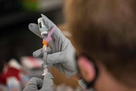 Pharmacist Jef Bratberg draws the Moderna Vaccine into syringes. (Photo by Joseph Prezioso / AFP) (Photo by JOSEPH PREZIOSO/AFP via Getty Images)