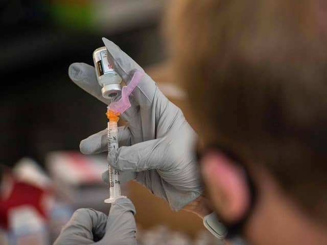 Pharmacist Jef Bratberg draws the Moderna Vaccine into syringes. (Photo by Joseph Prezioso / AFP) (Photo by JOSEPH PREZIOSO/AFP via Getty Images)