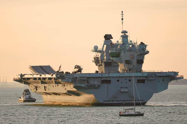 HMS Prince of Wales is tugged towards Stokes Bay on Monday after breaking down off the Isle of Wight Picture: Mark Cox